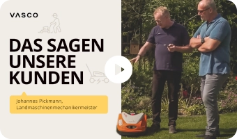 Two men in a lush garden look in one direction with satisfaction, and in the background there is an inscription 